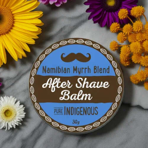 Natural After Shave Balm - Gentle Hydration for Men 30g in a vibrant floral setting with bright flowers.