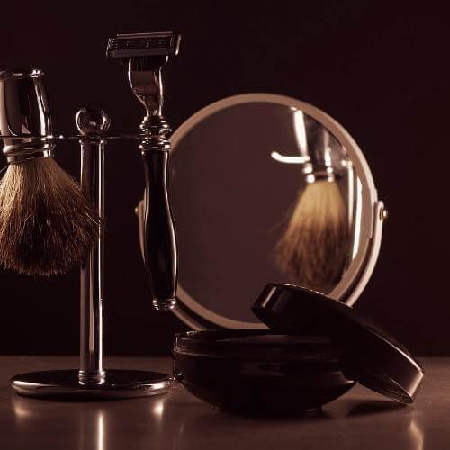 ZestySpiritz Beard Oil 20ml bottle displayed with a wooden beard comb on a rustic surface.