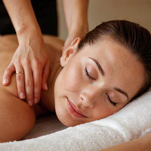 Happy Massage Oil with Rose Geranium being used in a relaxing massage for enhanced mood and relaxation.