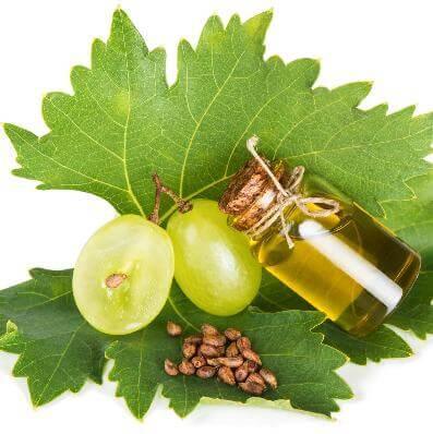 Tranquil Massage Oil with Cape Grapeseed Oil and fresh green leaves, ideal for relaxation and self-care.