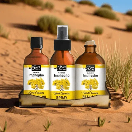 Imphepho body care gift set featuring essential oil, spray, and bath products in a natural desert setting.