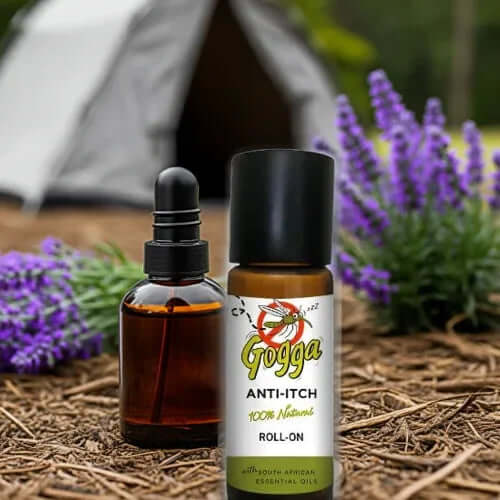 Lavender Tea Tree Roll-On 10ml placed outdoors, surrounded by lavender flowers, showcasing natural anti-itch relief.