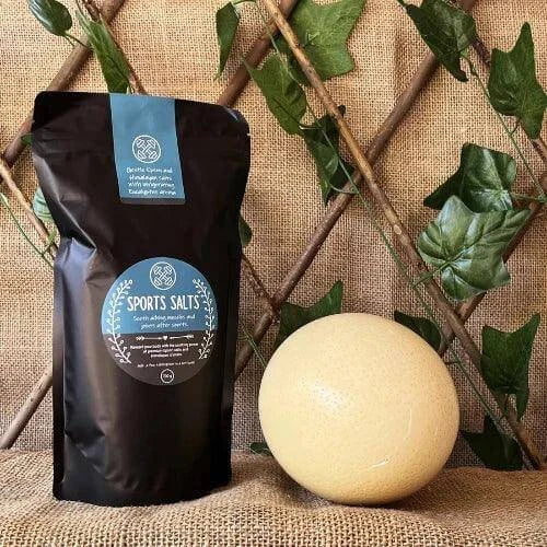 Sport Salt Soaks packaging alongside an exercise ball, showcasing rejuvenation for athletes.