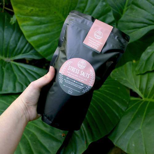 ZestySpiritz Stress Salt Soaks in various sizes displayed in clear jars, highlighting texture and soothing colors.