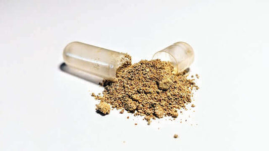 Ashwagandha adaptogen benefits showcased with capsules and herbal powder on a white background.